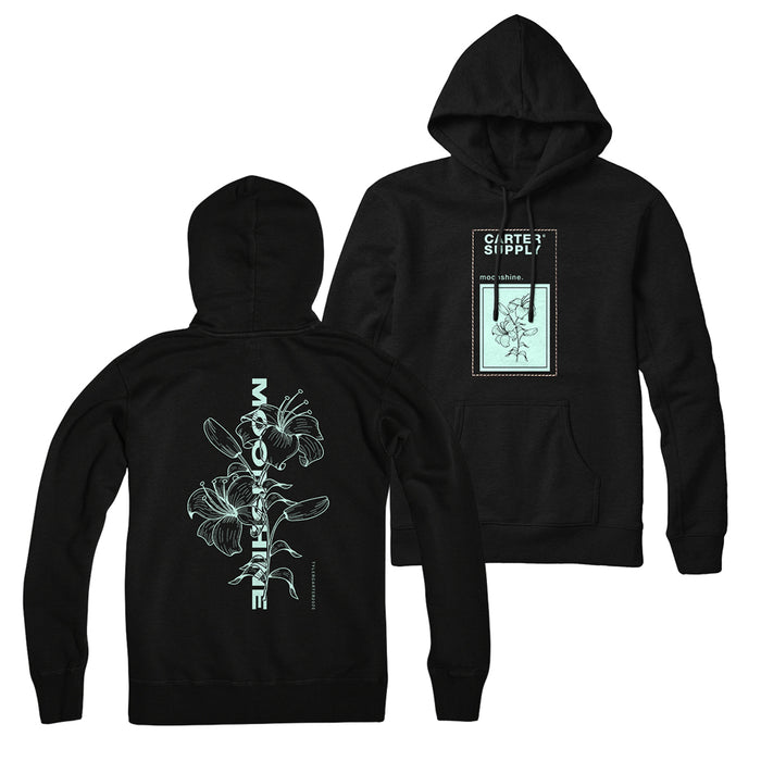 Two black Tyler Carter hoodies are shown front and back. The back displays a large light blue floral illustration with vertical text; the front features a small rectangular patch with a flower and the text CREATE SUPPLY and mid atlantic.