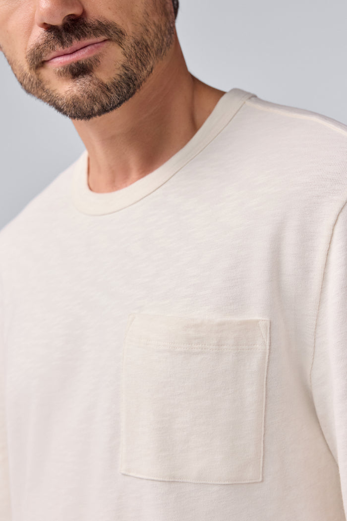 Pocket tee view of a man wearing Heavyweight Relaxed Long Sleeve T-Shirt in Froth