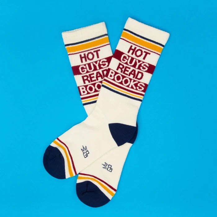 Pair of socks with 'Hot Guys Read Books' text on a blue background
