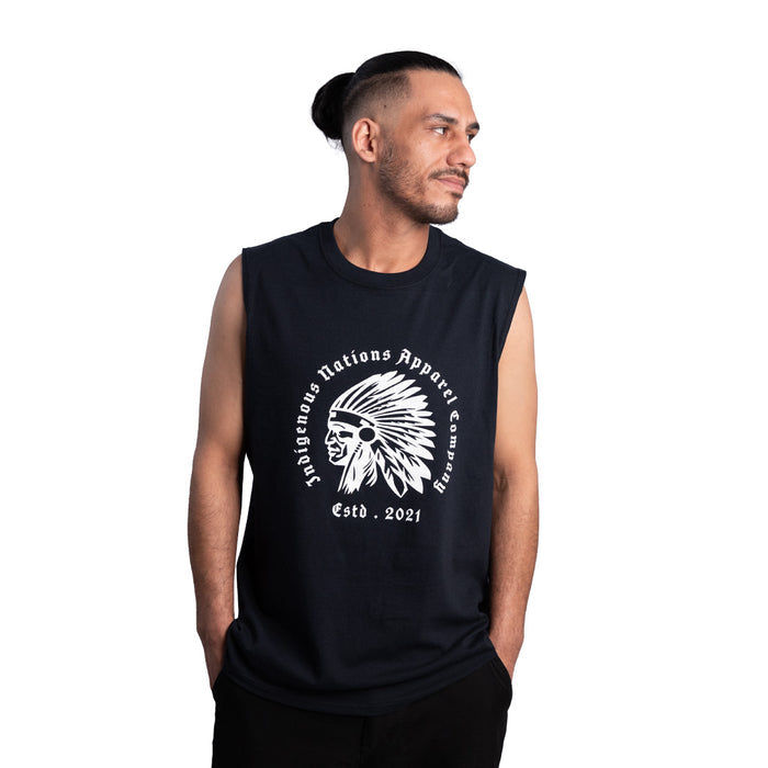 Man wearing a black sleeveless shirt with a logo and text on a white background