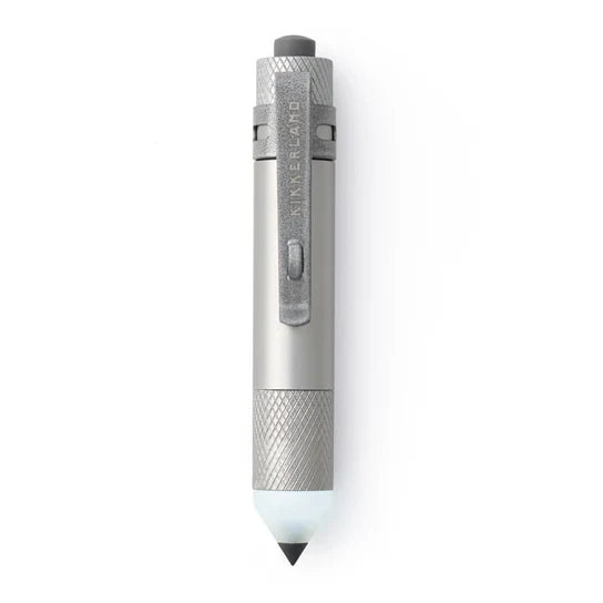 A sleek, metallic silver Kikkerland pen-style tool with textured grip sections and a pointed tip, shown vertically on a clean white background.