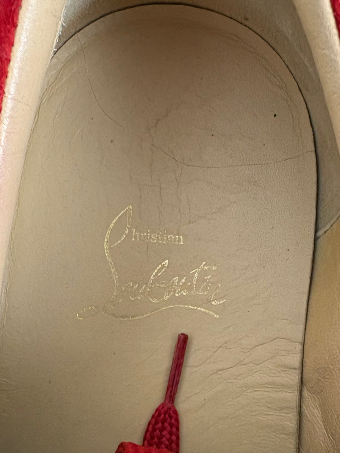 Louboutin red spike sneaker
