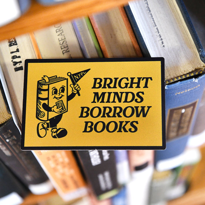 Yellow rectangular magnet that reads: Bright minds borrow books. It features an illustration of a book holding a library card and a pennant that reads: NYPL.