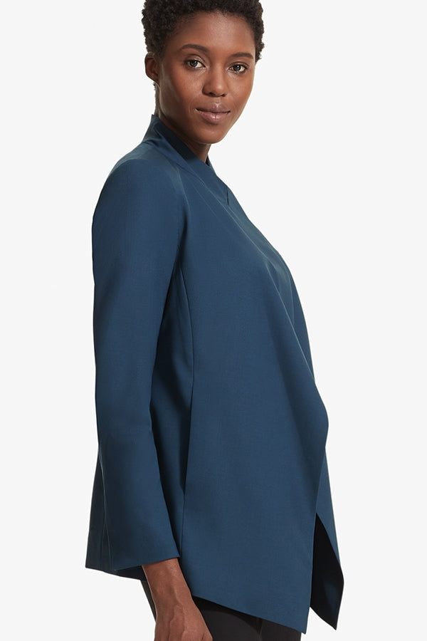 Side image of a woman standing wearing the Oliver jacket in Twilight | Grid Hover | Exclude