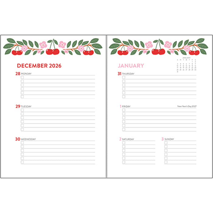 An open planner or calendar spread showing December 2026 on the left page and January on the right page, with a cherry and floral border across the top and lined writing areas below.