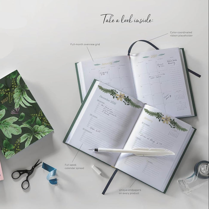 Weekly softcover planners with colorful designs on a white surface.