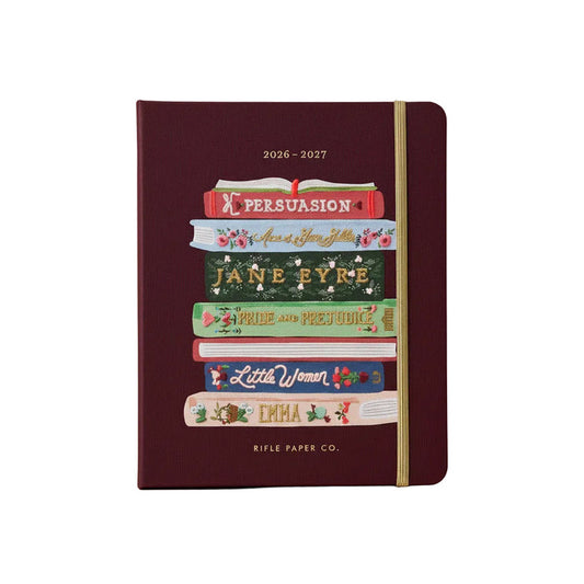 Maroon planner with book design on a white background