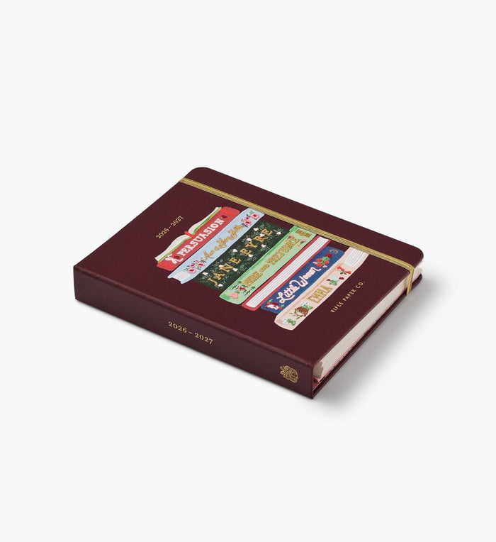 Maroon planner with colorful tabs on a white background