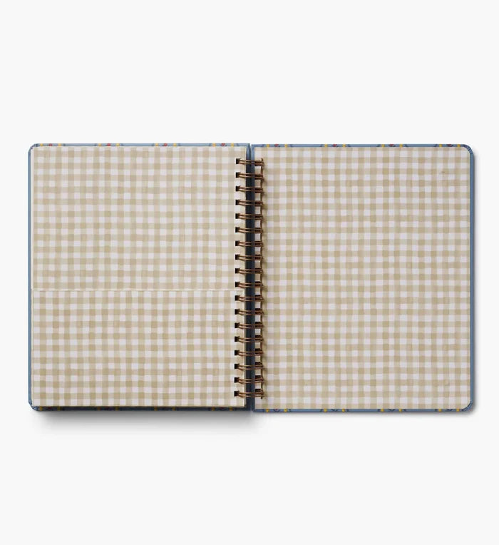 Open notebook with checkered pattern on a white background