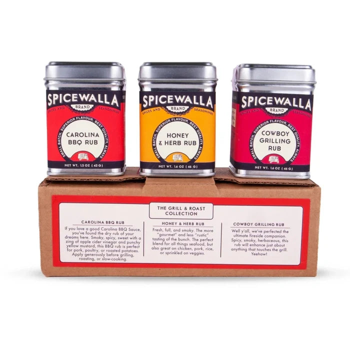 Three Spicewalla spice containers on a cardboard box with product descriptions.