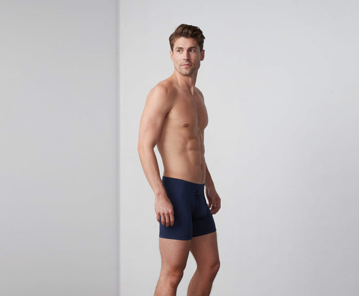 Side view of a man wearing Silver HD Boxer Brief in True Navy