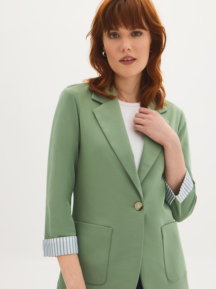 Lilac knit blazer with 3/4 sleeves and striped cuff lining, featuring patch pockets by Le Chateau.