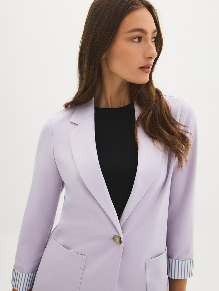Lilac knit blazer with 3/4 sleeves and striped cuff lining, featuring patch pockets by Le Chateau.