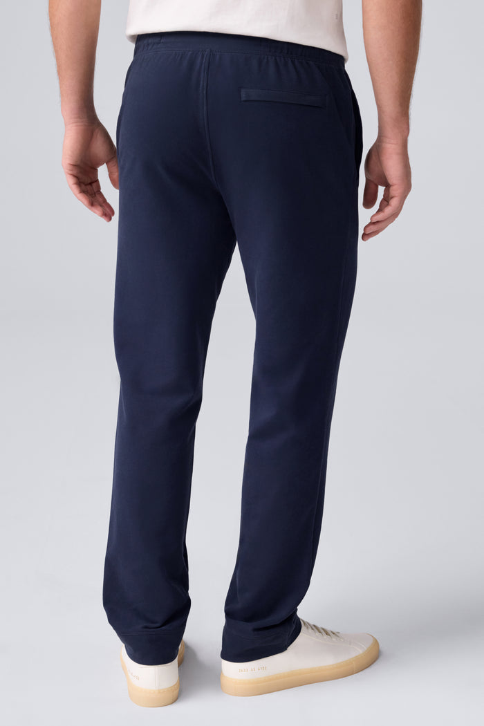 Back view of a man wearing ACE Straight Leg Pant in Total Eclipse Blue
