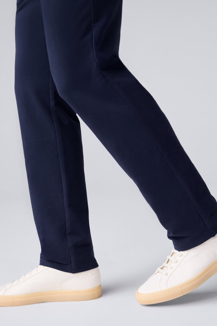 Side view of a man wearing ACE Straight Leg Pant in Total Eclipse Blue