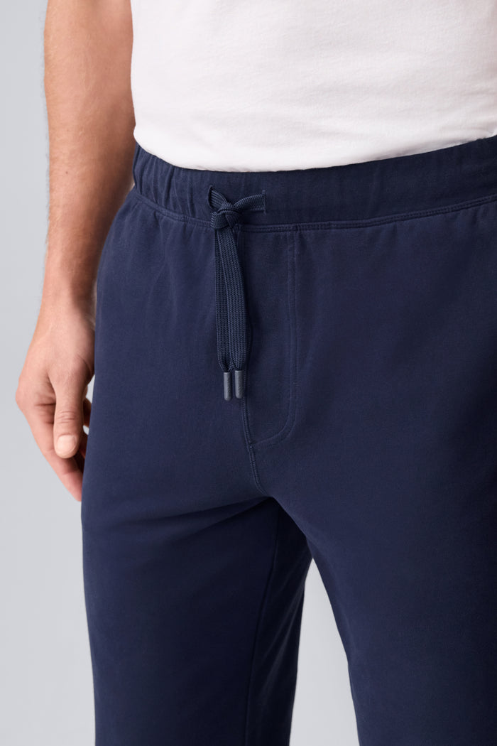 Close up view of a man wearing ACE Straight Leg Pant in Total Eclipse Blue