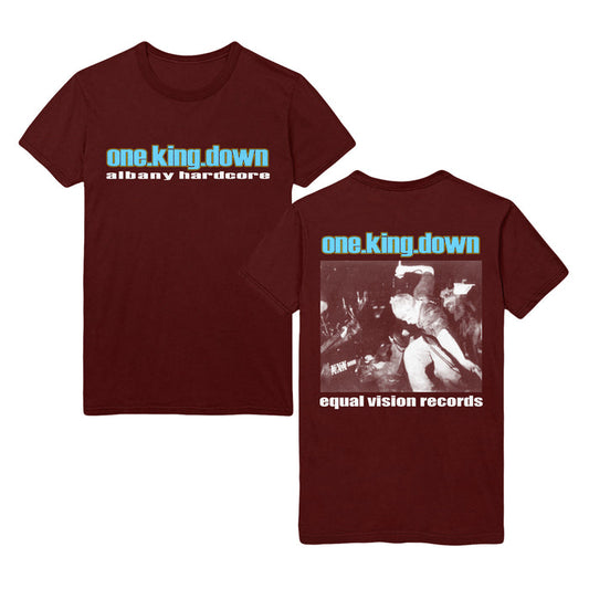 Front and back of a maroon One King Down T-shirt featuring bold white and blue text on the front. The back displays a concert photo, band name, and the Equal Vision Records logo.