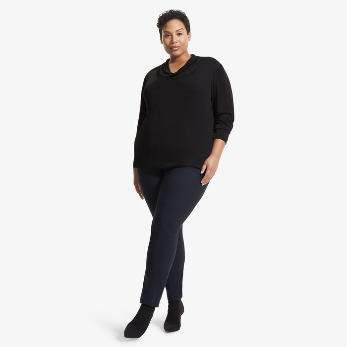 Front image of a woman standing wearing the Alma top in Black