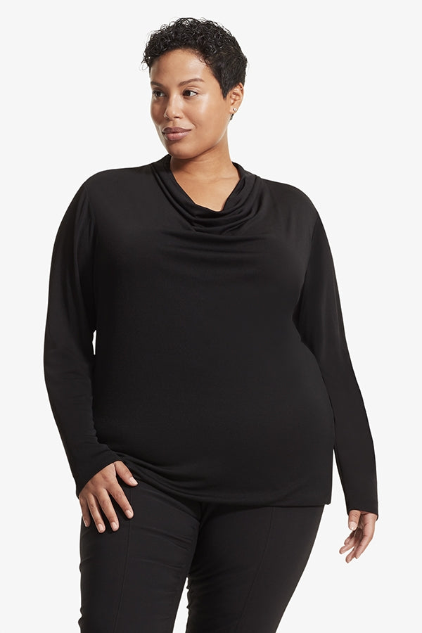 Front image of a woman standing wearing the Alma top in Black | Grid | Exclude