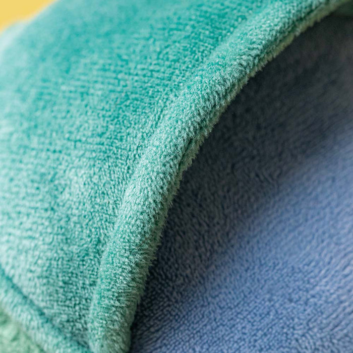 Close-up of a textured teal and blue fabric
