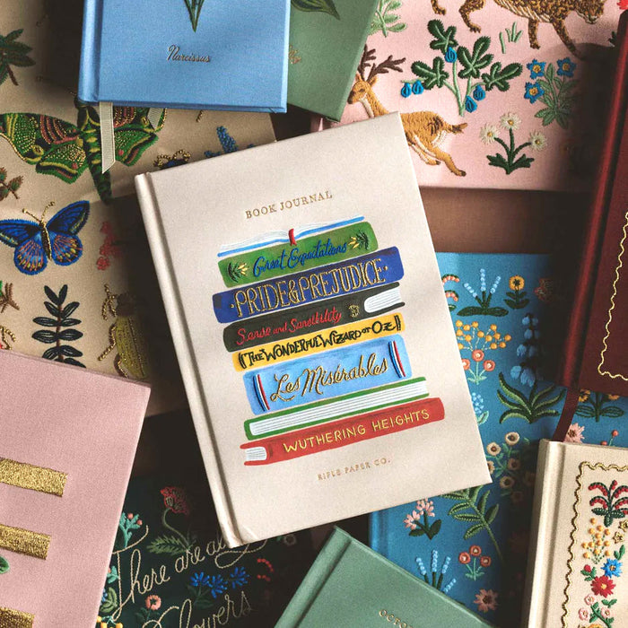 Book-shaped journal with literary titles on a colorful background