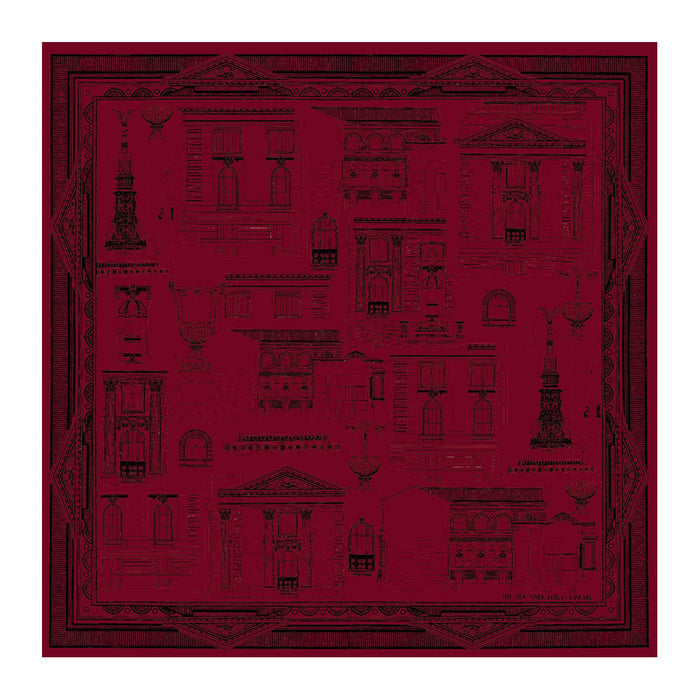 Red scarf with black architectural illustrations on a white background
