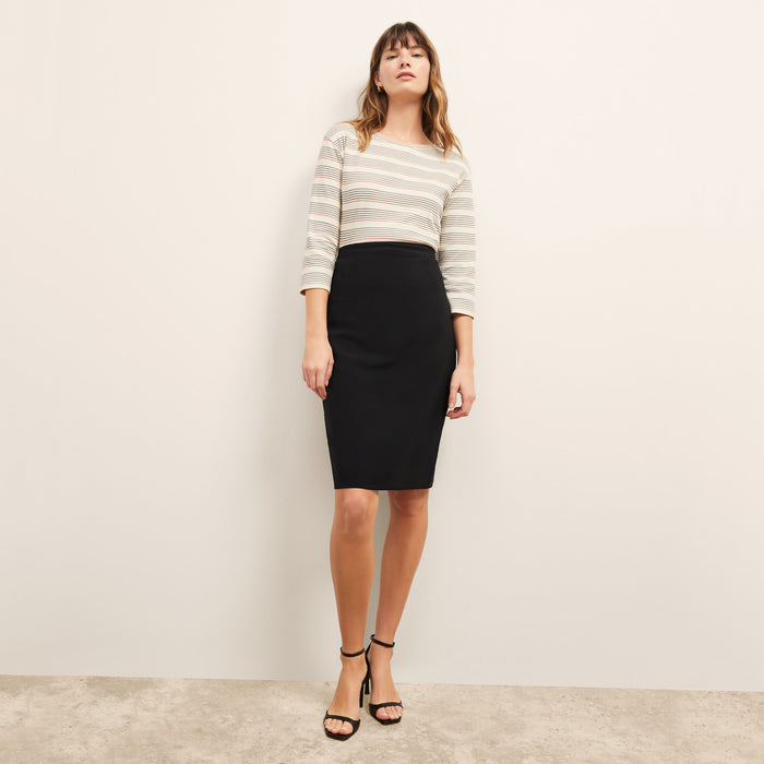 Front image of a woman standing wearing the cobble hill packable suiting in black