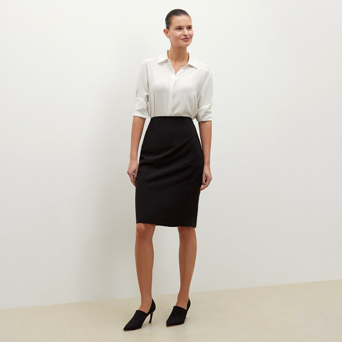 Front image of a woman standing wearing the cobble hill packable suiting in black | Exclude