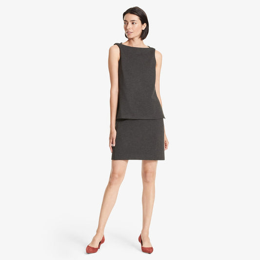 Front image of a woman standing wearing the Crosby skirt textured ponte in Charcoal