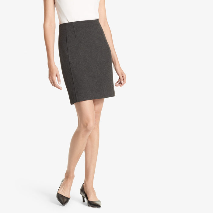 Front image of a woman standing wearing the Crosby skirt textured ponte in Charcoal | Lead | Exclude
