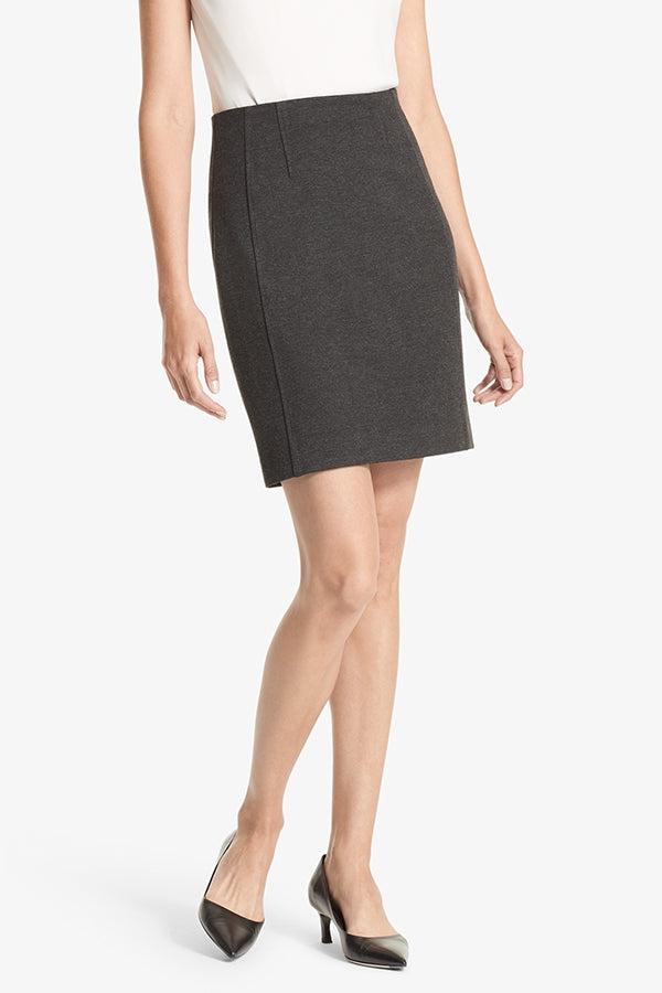 Front image of a woman standing wearing the Crosby skirt textured ponte in Charcoal | Grid | Exclude