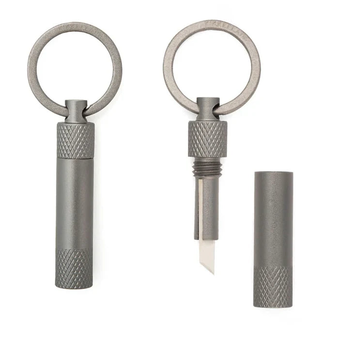 Metal keychain with a blade on a white background