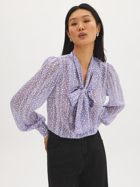Ditsy floral blouse with side pussy bow and long sleeves by Suzy Shier.