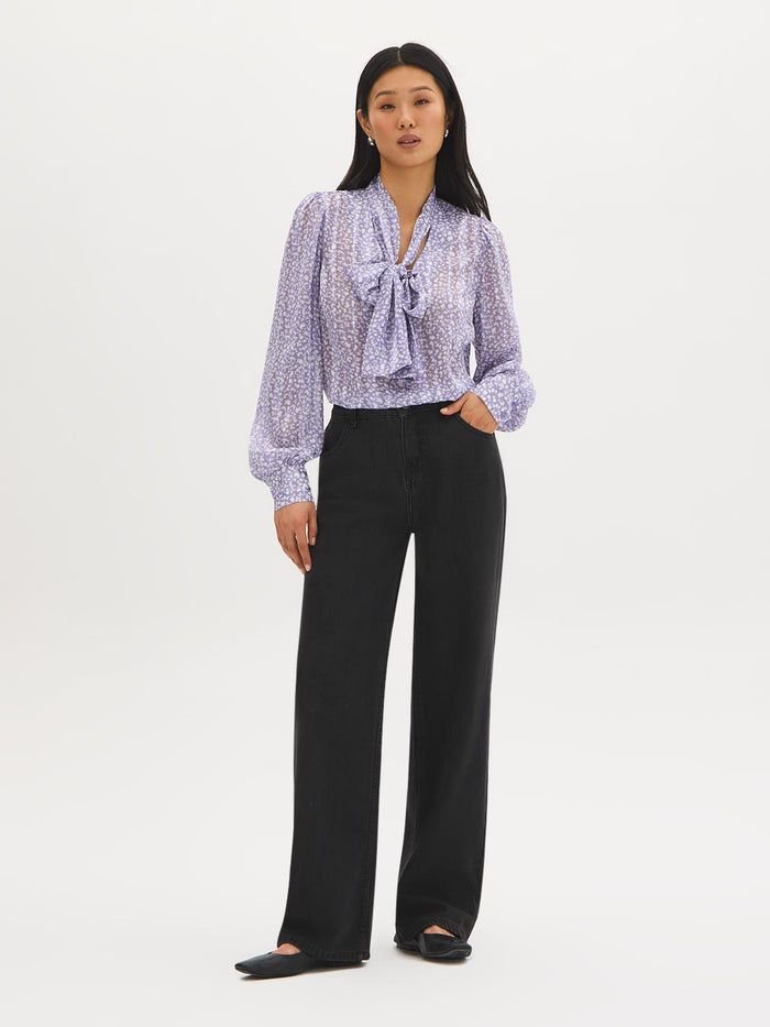 Ditsy floral blouse with side pussy bow and long sleeves by Suzy Shier.