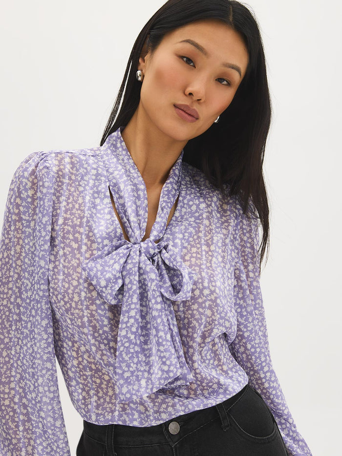 Ditsy floral blouse with side pussy bow and long sleeves by Suzy Shier.
