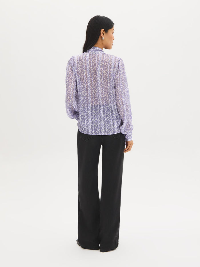 Ditsy floral blouse with side pussy bow and long sleeves by Suzy Shier.
