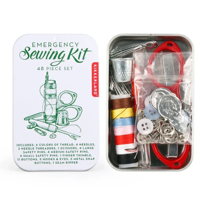 Emergency Sewing Kit 48-piece set in a metal tin, shown open with the white illustrated lid on the left and the contents visible on the right, including thread, safety pins, scissors, needles, buttons, and a red seam ripper.