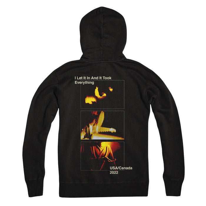 Loathe black pullover hoodie laid flat, with three abstract yellow-orange images stacked on the back. White text above and below reads: I Let It In And It Took Everything, Fall 2022 Tour USA/Canada.