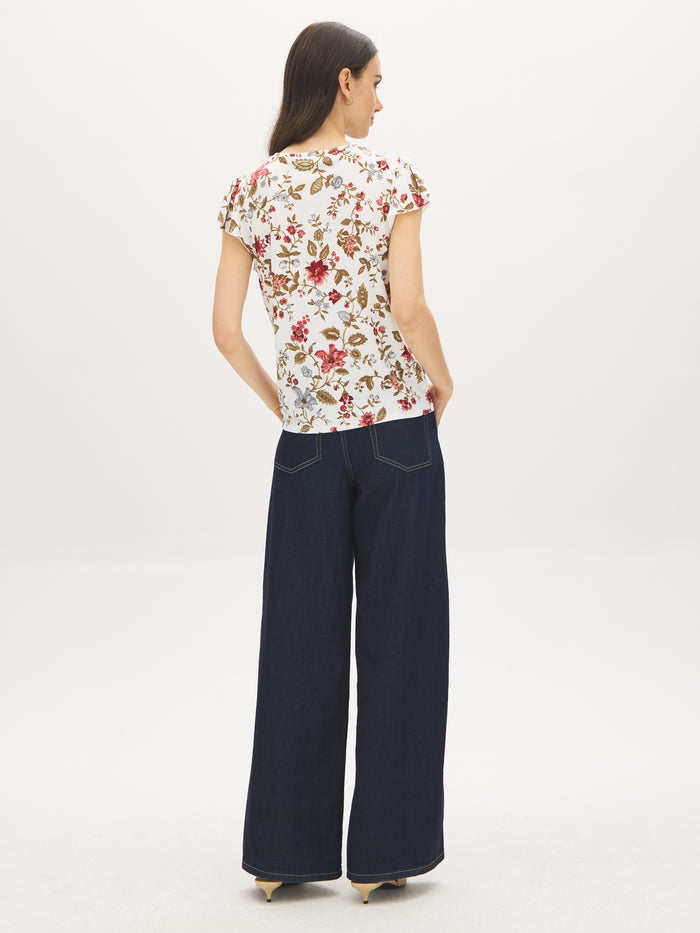 Snow White Floral Knit Top with Ruffle Sleeves - Back View - Suzy Shier