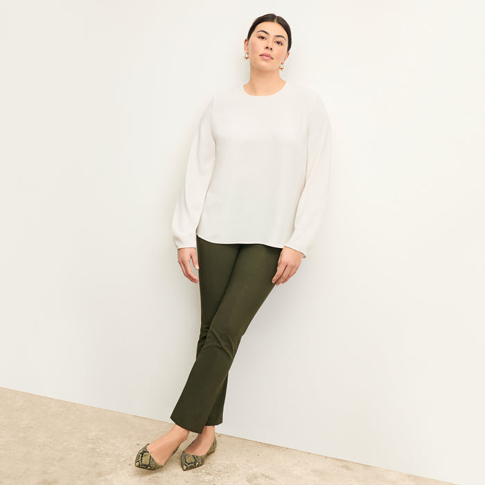 front image of woman wearing foster pant in dark olive | Exclude