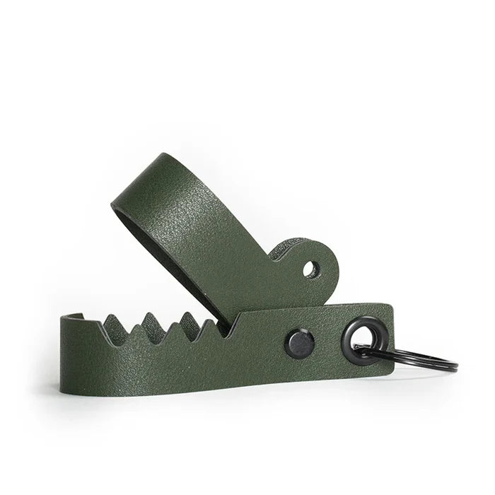 Phone stand simulating a green gator with an open mouth.