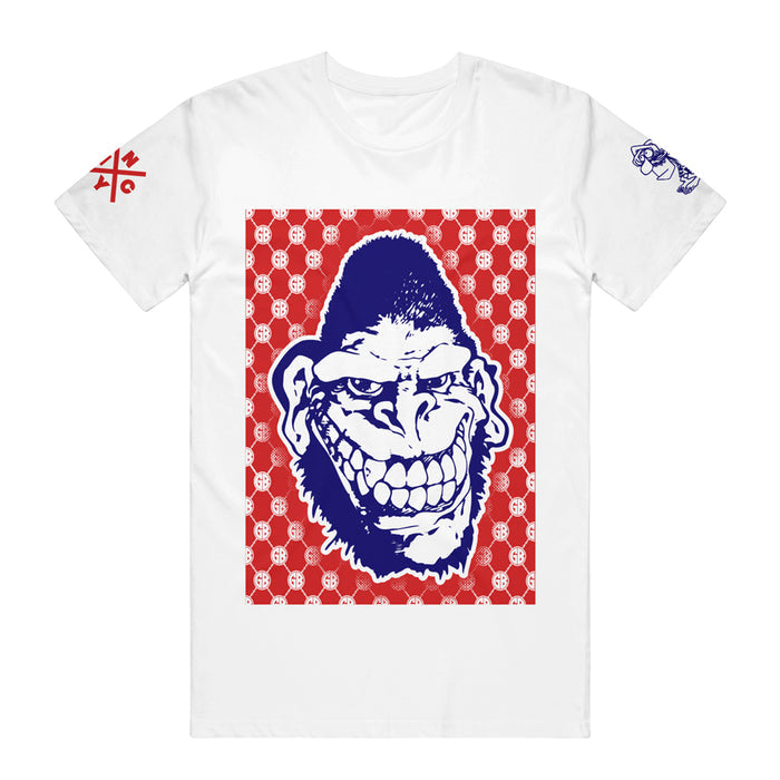 Gorilla Biscuits white T-shirt with a large blue and white cartoon gorilla face on a red patterned background; red and blue graphic symbols appear on the sleeves.