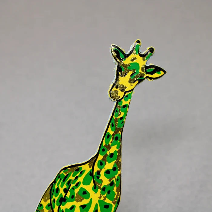 Colorful giraffe bookmark in yellow and green on a gray background