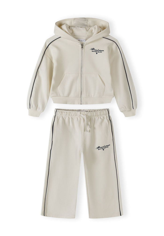 Girls white hooded tracksuit with zip jacket and elastic waist, front view.
