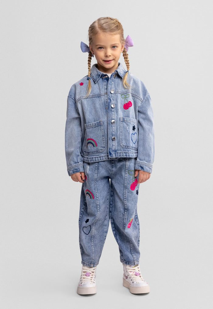 Girls' blue denim barrel shape jeans with embroidered details, front view.