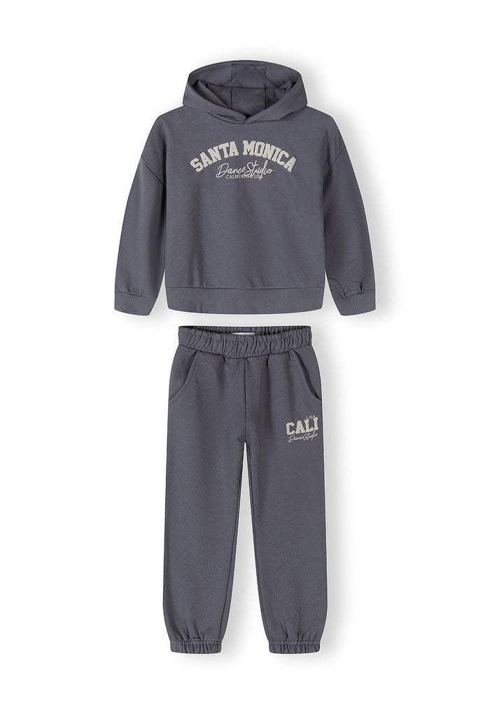 Girls' blue-grey hooded tracksuit with tapered trousers, featuring logo prints.