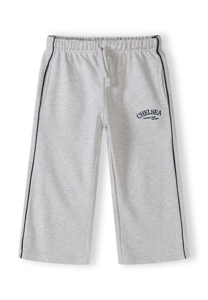 Detail of grey marl wide-leg jogging trousers with side pockets and adjustable waistband.