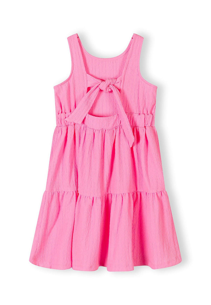 Girls sleeveless pink tiered summer dress with adjustable back tie.