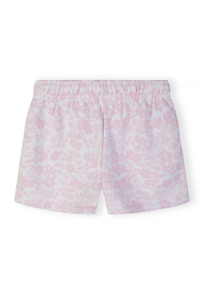 Back view of girls' white shorts with pink floral embroidery and elastic waistband.