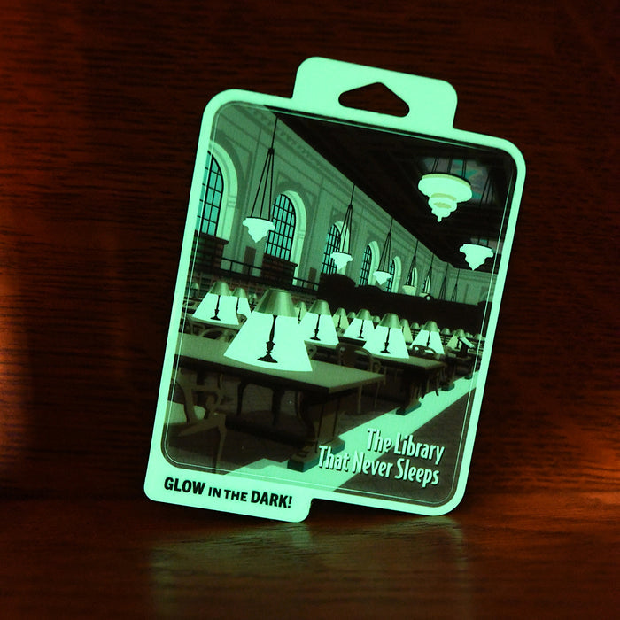 Same sticker captured in a dark room, emitting a bright green luminescent glow.